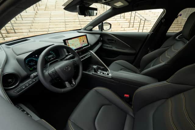 The interior of a left-hand drive Toyota CH-R PHEV. Credit: Toyota