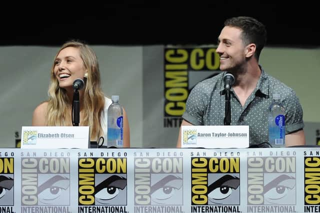 Actress Elizabeth Olsen and actor Aaron Taylor-Johnson speak onstage. Image: Getty