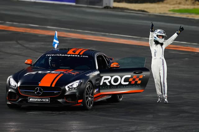 Susie Wolff of Scotland waves to the crowd during the Race of Champions. 