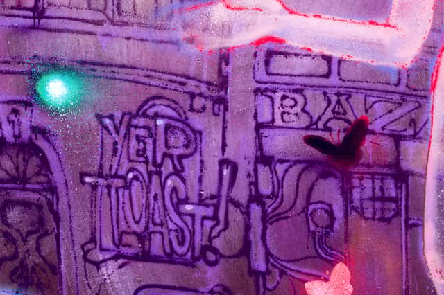 One of Clove's lines from the game appears in the mural.