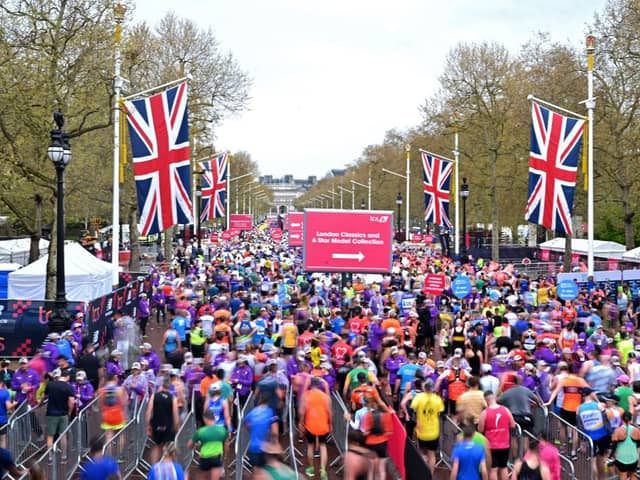 Runners reach the finish of the 2023 London Marathon.