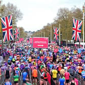 Runners reach the finish of the 2023 London Marathon.