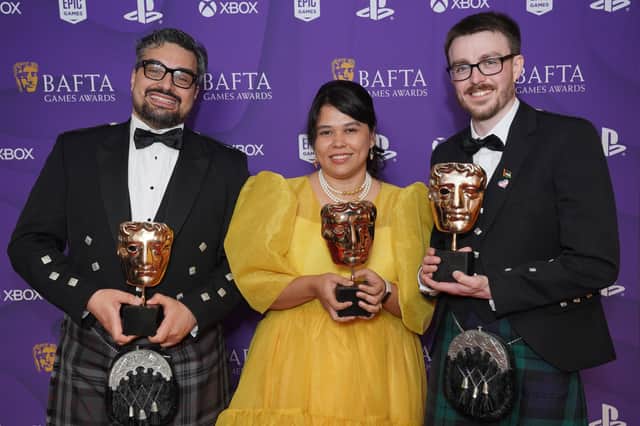 Georg Backer, Gwendelyn Foster, and Matthew Stark pose with their awards after winning the New Intellectual Property Award for 'Viewfinder' and the British Game Award for 'Viewfinder'. Image: Jonathan Brady/PA Wire 