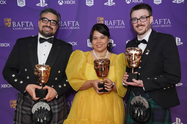 Georg Backer, Gwendelyn Foster, and Matthew Stark pose with their awards after winning the New Intellectual Property Award for 'Viewfinder' and the British Game Award for 'Viewfinder'. Image: Jonathan Brady/PA Wire 