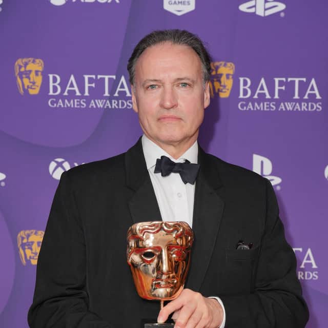 Andrew Wincott poses with his award after winning the Performer in a Supporting Role Award for the portrayal of Raphael in 'Baldur's Gate 3'. Image: Jonathan Brady/PA Wire