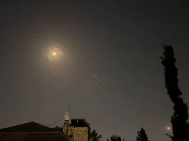 This video grab from AFPTV taken on April 14, 2024 shows explosions lighting up Jerusalem sky during Iranian attack on Israel. Iran's Revolutionary Guards confirmed early April 14, 2024 that a drone and missile attack was under way against Israel in retaliation for a deadly April 1 drone strike on its Damascus consulate.