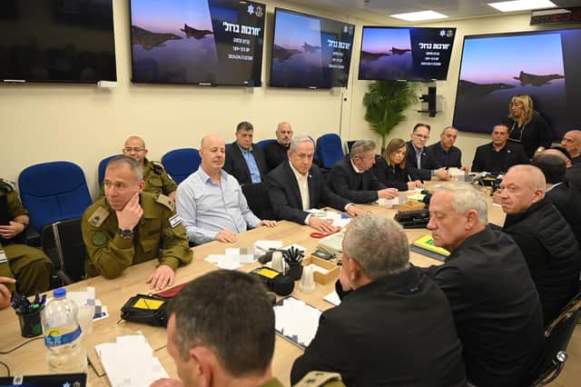 TOPSHOT - This handout picture courtesy of the Israeli Prime Minister's Office taken on April 14, 2024 shows Israel's Prime Minister Benjamin Netanyahu (C) during a War Cabinet meeting at the Kirya in Tel Aviv.
