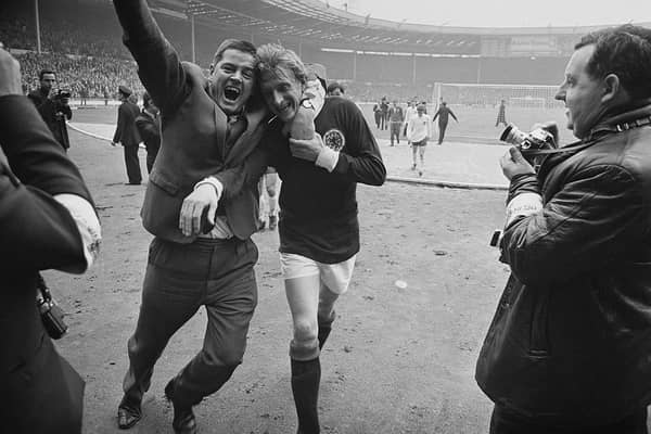 Scottish football player Denis Law is hugged by a fan after Scotland beat England 3-2 at Wembley. Cr. Getty Images.