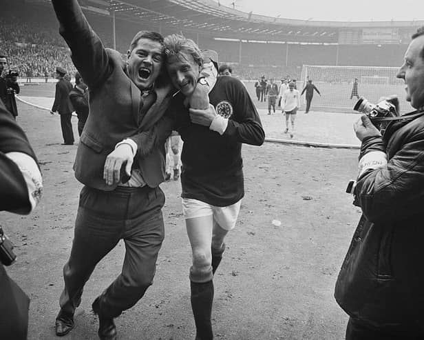 Scottish football player Denis Law is hugged by a fan after Scotland beat England 3-2 at Wembley. Cr. Getty Images.