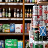 MSPs on a Holyrood committee have been urged to increase the minimum unit price (MUP) on alcohol to 65p. Image: Jane Barlow/PA Wire
