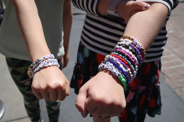 Taylor Swift fans exchange friendship bracelets during her shows. 