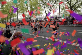 Confetti is fired by people watching the masses on the Embankment during the TCS London Marathon. Picture date: Sunday April 21, 2024. PA Photo. See PA story ATHLETICS London. Photo credit should read: Yui Mok/PA Wire