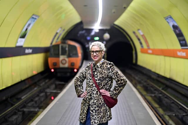 Anna Campbell-Jones with one of the old Glasgow Subway trains which are all due to be taken out of service by the end of the year. (Photo by John Devlin/The Scotsman)