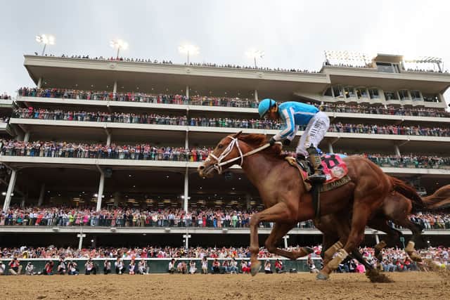 Javier Castellano celebrates atop Mage after crossing the finish line to win the 149th running of the Kentucky Derby at Churchill Downs on May 6, 2023, in Louisville, Kentucky. 