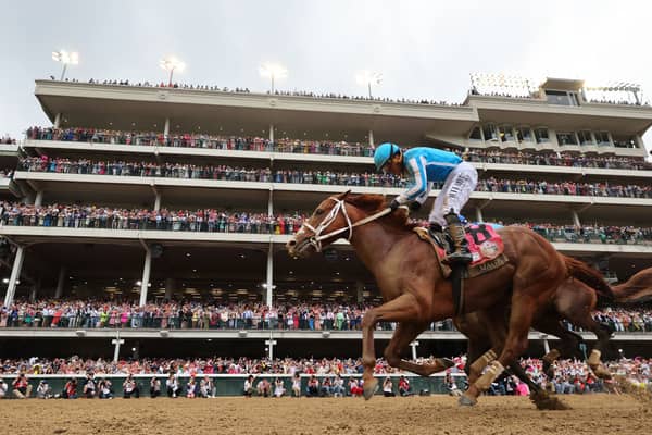 Javier Castellano celebrates atop Mage after crossing the finish line to win the 149th running of the Kentucky Derby at Churchill Downs on May 6, 2023, in Louisville, Kentucky. 