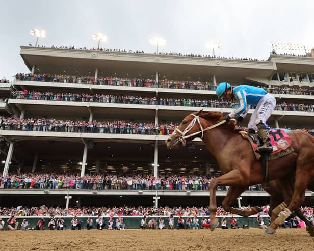 Javier Castellano celebrates atop Mage after crossing the finish line to win the 149th running of the Kentucky Derby at Churchill Downs on May 6, 2023, in Louisville, Kentucky. 