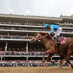 Javier Castellano celebrates atop Mage after crossing the finish line to win the 149th running of the Kentucky Derby at Churchill Downs on May 6, 2023, in Louisville, Kentucky. 