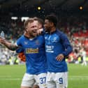Former Rangers player Scott Arfield and Amad Diallo celebrate a 2-1 win over Celtic at Hampden Park in 2022. Cr. Getty Images.