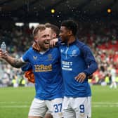 Former Rangers player Scott Arfield and Amad Diallo celebrate a 2-1 win over Celtic at Hampden Park in 2022. Cr. Getty Images.