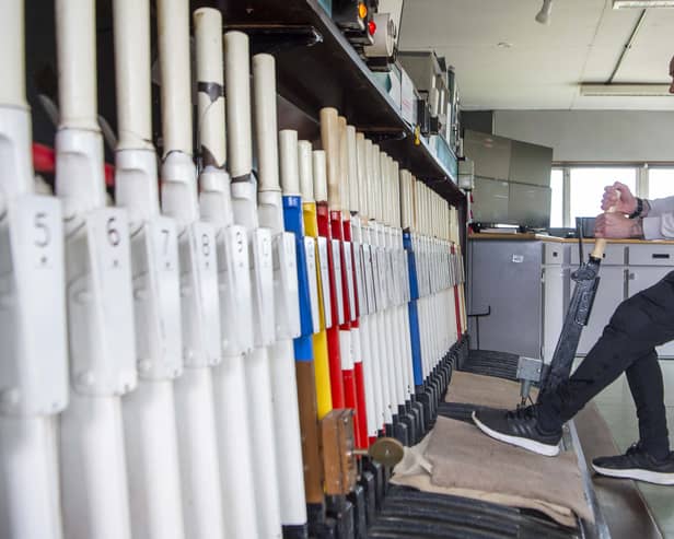 Signaller Gordon McCabe pulling a signal lever in Stanley Junction signal box. (Photo by Lisa Ferguson/The Scotsman)