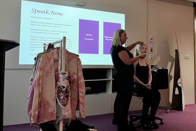Angela McConnachie, a GCC lecturer, demonstrating how to achieve Taylor Swift's signature looks. 