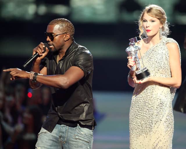 Kanye West jumping onstage after Taylor Swift won the "Best Female Video" award during the 2009 MTV VMAs. Image: Getty