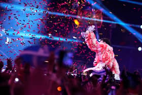 MALMO, SWEDEN - MAY 11: Nemo from Switzerland, winner of the Eurovision Song Contest, raises the trophy on stage after The Eurovision Song Contest 2024 Grand Final at Malmo Arena on May 11, 2024 in Malmo, Sweden. (Photo by Martin Sylvest Andersen/Getty Images)