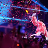 MALMO, SWEDEN - MAY 11: Nemo from Switzerland, winner of the Eurovision Song Contest, raises the trophy on stage after The Eurovision Song Contest 2024 Grand Final at Malmo Arena on May 11, 2024 in Malmo, Sweden. (Photo by Martin Sylvest Andersen/Getty Images)