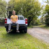 Scotsman Writer Steven Chisholm sits in the back of the Ford Ranger XL test car near a section of gravel track. Credit: Steven Chisholm