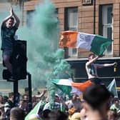 Two police officers were injured in Glasgow city centre after Celtic beat Hearts 3-1 to dramatically win the league title on the last match of the season.