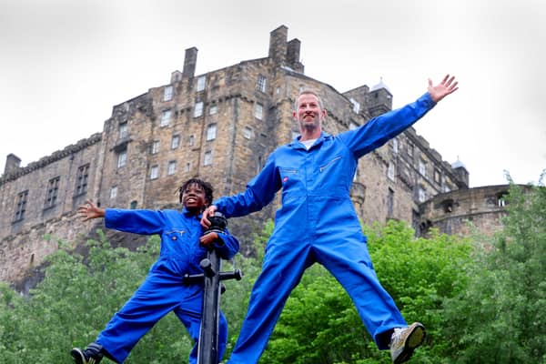 Performers Robbie Synge and Alfie, 10, from dance show The Show for Young Men perform against the backdrop of the Edinburgh Castle. Picture: Colin Hattersley Photography/Federation of Scottish Theatre