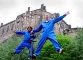 Performers Robbie Synge and Alfie, 10, from dance show The Show for Young Men perform against the backdrop of the Edinburgh Castle. Picture: Colin Hattersley Photography/Federation of Scottish Theatre