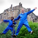 Performers Robbie Synge and Alfie, 10, from dance show The Show for Young Men perform against the backdrop of the Edinburgh Castle. Picture: Colin Hattersley Photography/Federation of Scottish Theatre