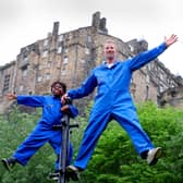 Performers Robbie Synge and Alfie, 10, from dance show The Show for Young Men perform against the backdrop of the Edinburgh Castle. Picture: Colin Hattersley Photography/Federation of Scottish Theatre