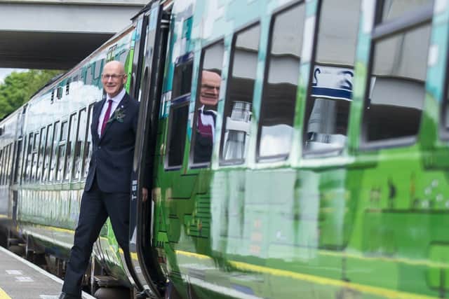 First Minister John Swinney steps off a train at Leven Station to officially open the Levenmouth rail line on Wednesday. (Photo by Lisa Ferguson/The Scotsman)