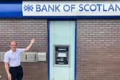 Councillor Neill Watts outside the Bank of Scotland branch that will close in four weeks, and take the ATM with it 