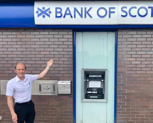 Councillor Neill Watts outside the Bank of Scotland branch that will close in four weeks, and take the ATM with it 