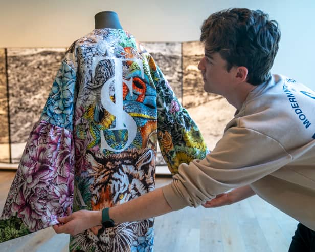The kimono was created by Glasgow School of Art graduate KellyDawn Riot, who used her distinctive hand-crafted illustrations and took inspiration from Taylor Swift's music, the colour schemes associated with each album, and mentions of animals, flora and fauna in Swift's song lyrics to create individual collages representing each of the 11 albums.