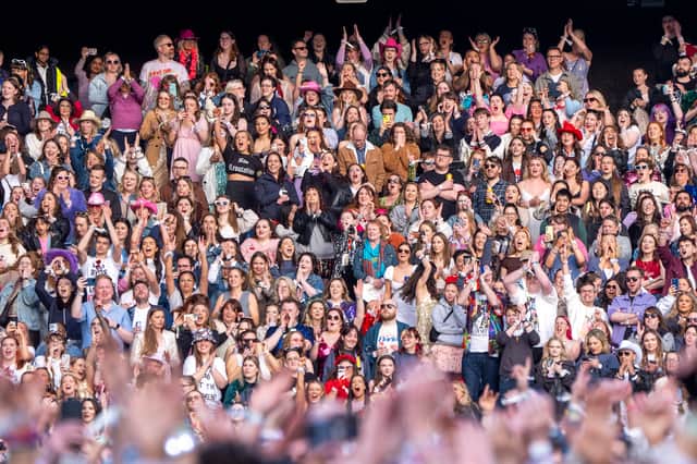 Fans in the stand watching Taylor Swift's Edinburgh Eras Tour show. 