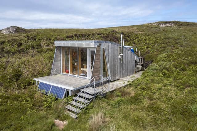 The eco-home is clad in larch