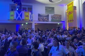 Scotland fans take in the party at an old post office in Munich.