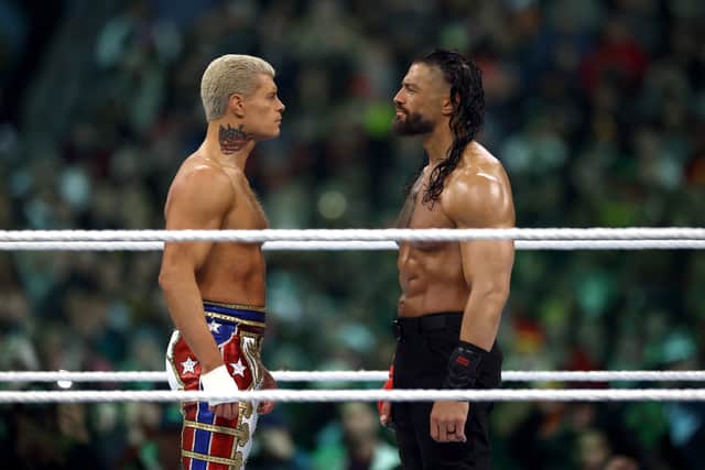 Roman Reigns and Cody Rhodes look on during Night Two at Lincoln Financial Field on April 07, 2024 in Philadelphia, Pennsylvania. (Photo by Tim Nwachukwu/Getty Images)