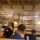 Piper falls off table in pub while entertaining Scotland fans.