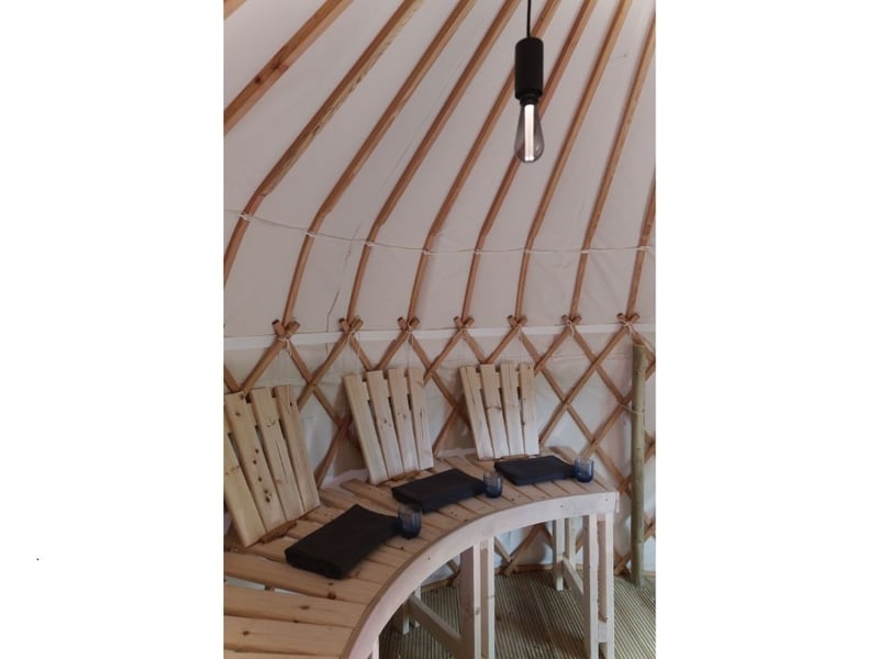 The inside of the sauna yurt. There's also a spring water plunge pool to brave.