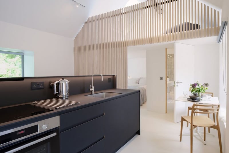 You'll find a bespoke, hand-crafted kitchen at the top of a folded steel staircase.