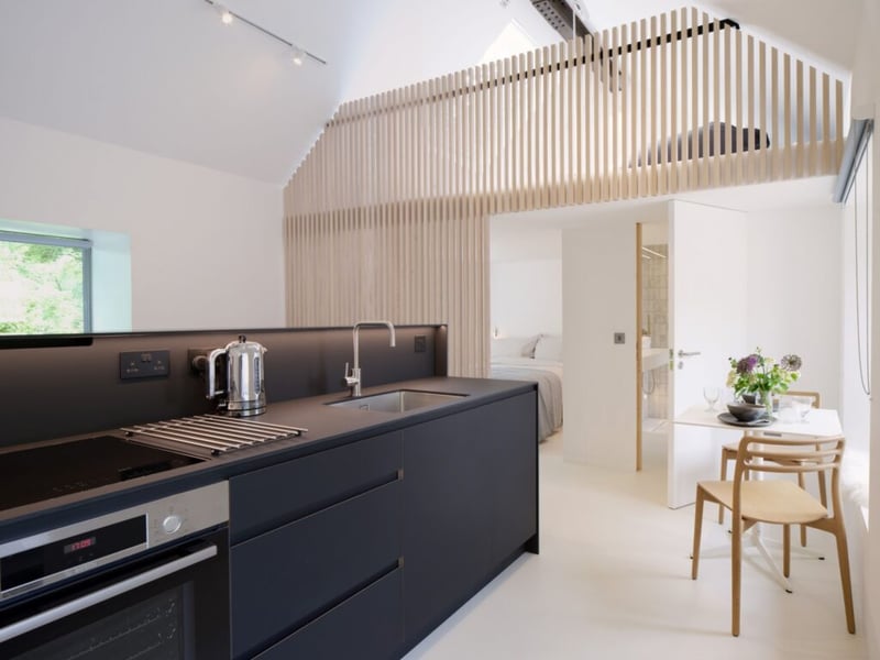 You'll find a bespoke, hand-crafted kitchen at the top of a folded steel staircase.