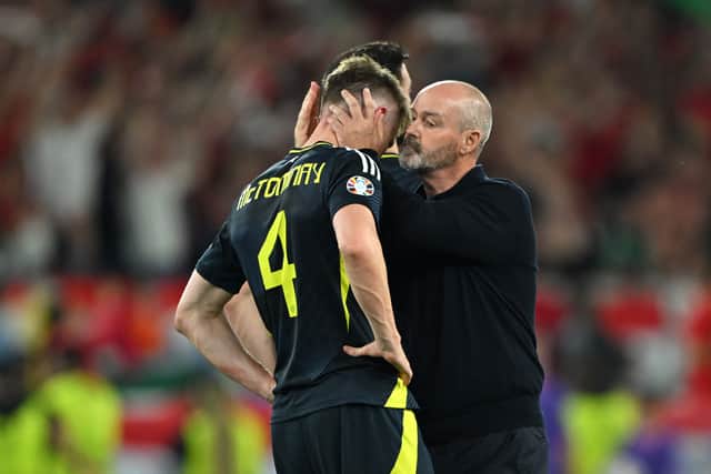 Steve Clarke consoles Scott McTominay after the defeat by Hungary.