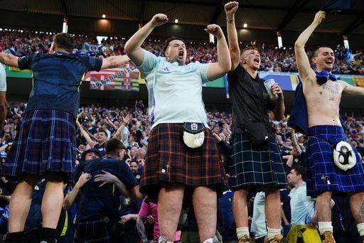 Our favourite photo. The moment of hope. Scotland fans celebrate Scott McTominay's goal against Switzerland.