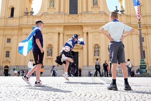 Some young fans enjoy a kickabout in Odeonsplatz, Munich.