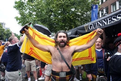 Scotland fans in the rain at the Old Market, Cologne.